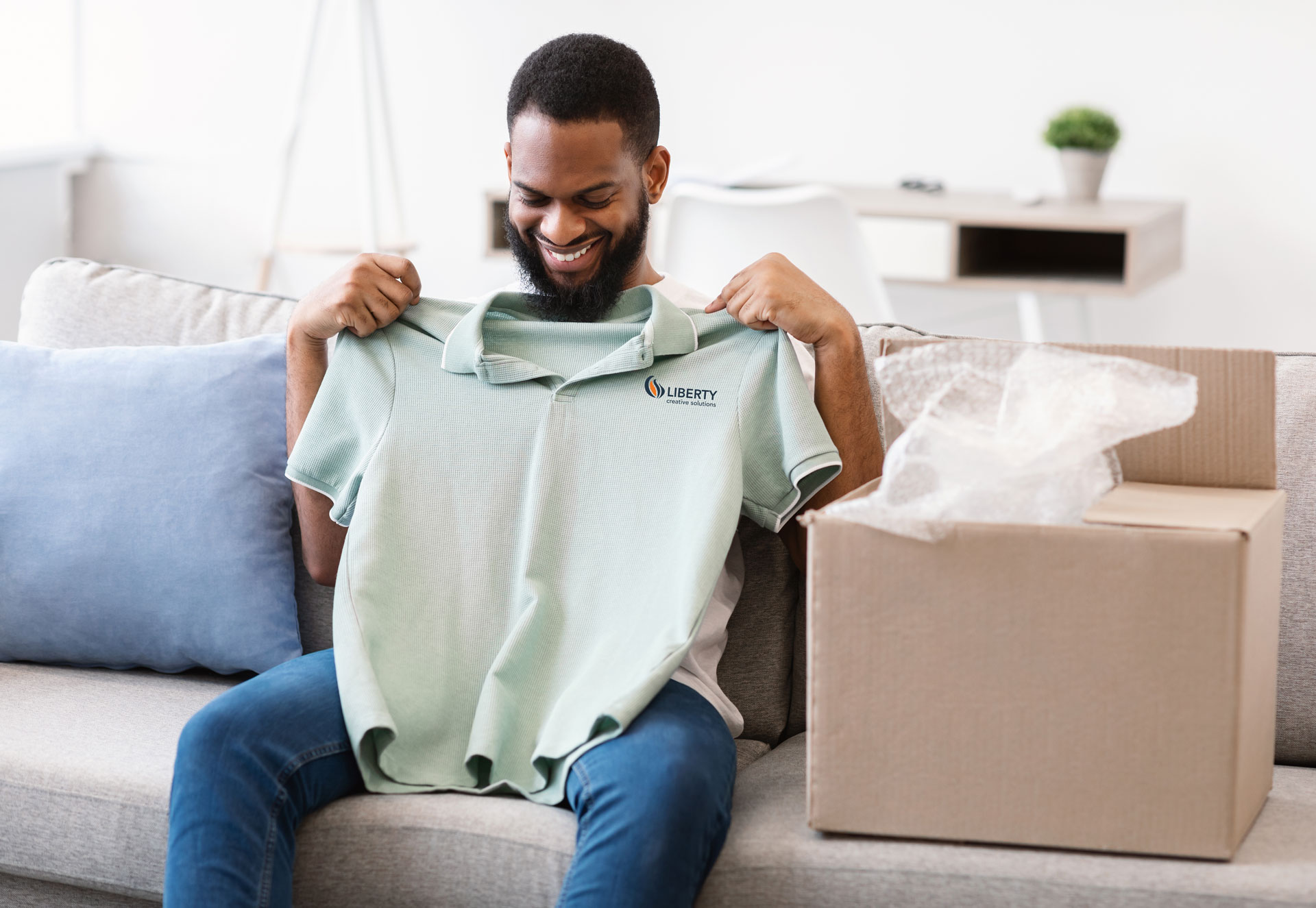 A casino patron receives a custom kit with a branded shirt in the mail.
